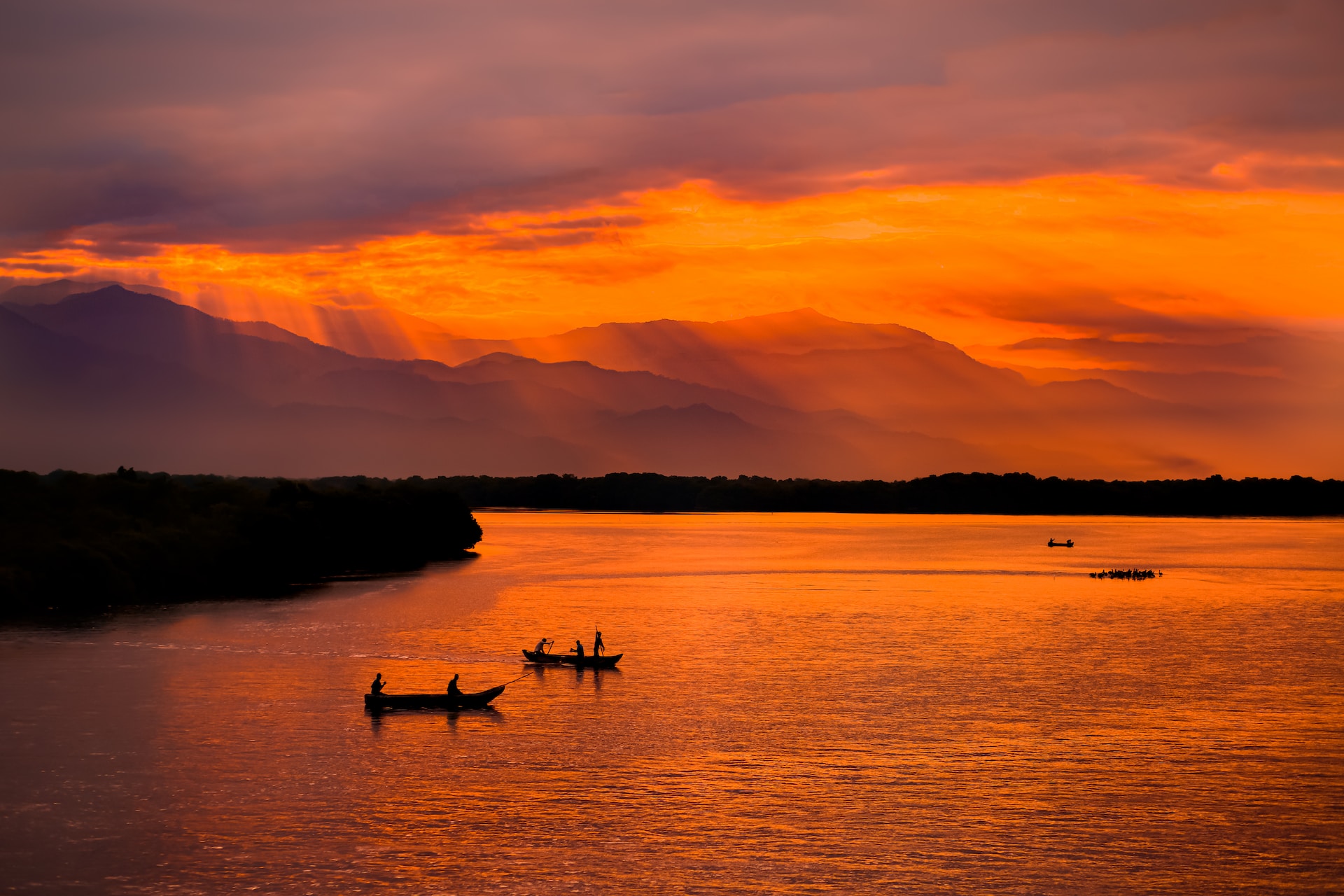 Fishermen near Santa Marta, Colombia with the Sierra Nevada mountains in the distance.